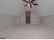 Expansive bedroom with neutral carpet and a ceiling fan under vaulted ceilings at 5028 Chapel Lake Cir, Douglasville, GA 30135