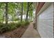 View of home's exterior featuring a red brick walkway leading to the side-entry garage at 5028 Chapel Lake Cir, Douglasville, GA 30135
