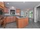 Well-appointed kitchen with granite countertops, an island cooktop, and views of the lake at 5028 Chapel Lake Cir, Douglasville, GA 30135