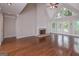 Bright and airy living room with a stone fireplace, hardwood floors, and large windows at 5028 Chapel Lake Cir, Douglasville, GA 30135