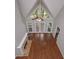 Bright living room with vaulted ceiling, stone fireplace, hardwood floors, and natural light at 5028 Chapel Lake Cir, Douglasville, GA 30135