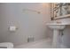 Elegant powder room featuring a pedestal sink, gold accents, and stylish decor at 5028 Chapel Lake Cir, Douglasville, GA 30135