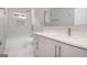 Stylish bathroom with a shower-tub combo, sleek vanity, and marble accents, providing a clean and modern design at 7428 Mockingbird Trl, Riverdale, GA 30274