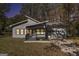 Charming modern home with gray siding, covered porch, and attached garage, perfect for comfortable living at 7428 Mockingbird Trl, Riverdale, GA 30274