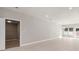 Bright, open living room featuring modern flooring, neutral walls, and ample natural light from large windows at 7428 Mockingbird Trl, Riverdale, GA 30274