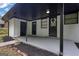 Covered back porch with a door, black posts, and dark trim accents at 2315 Shancey Ln, South Fulton, GA 30349
