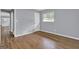 Cozy bedroom with hardwood flooring, a window, and a closet door at 2315 Shancey Ln, South Fulton, GA 30349