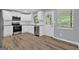 Updated kitchen with white cabinets, stainless steel appliances, and modern finishes at 2315 Shancey Ln, South Fulton, GA 30349