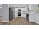 Contemporary kitchen with stainless steel appliances, white cabinetry, and modern style at 2315 Shancey Ln, South Fulton, GA 30349