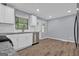 Modern kitchen features white cabinets, stainless steel appliances, and granite countertops at 2315 Shancey Ln, South Fulton, GA 30349