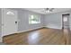 Inviting living room features hardwood floors, a front door, and large windows at 2315 Shancey Ln, South Fulton, GA 30349