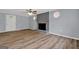 Spacious living room with a brick fireplace, ceiling fan, and natural light at 2315 Shancey Ln, South Fulton, GA 30349