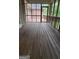 Enclosed back porch with stained wood and view of the backyard at 2329 Lochinver Sw Ln, Conyers, GA 30094