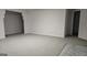 Finished basement with neutral carpet, gray walls and tile flooring at 2329 Lochinver Sw Ln, Conyers, GA 30094