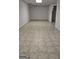 Spacious unfinished basement area with tile flooring, ready for customization at 2329 Lochinver Sw Ln, Conyers, GA 30094