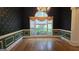 Dining room with chair rail trim, hardwood floors, a chandelier, and large window at 2329 Lochinver Sw Ln, Conyers, GA 30094