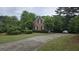 Charming brick home with a well-manicured lawn and a curved driveway at 2329 Lochinver Sw Ln, Conyers, GA 30094