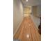 Hallway features hardwood flooring, a white bannister, and white walls at 2329 Lochinver Sw Ln, Conyers, GA 30094