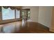 Bright living room with hardwood floors and large windows at 2329 Lochinver Sw Ln, Conyers, GA 30094
