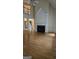 Bright living room with a fireplace, hardwood floors, and open layout at 2329 Lochinver Sw Ln, Conyers, GA 30094