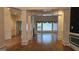 Spacious living area with hardwood floors, elegant columns, and plenty of natural light at 2329 Lochinver Sw Ln, Conyers, GA 30094