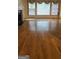 Spacious living area with hardwood floors, fireplace, and natural light at 2329 Lochinver Sw Ln, Conyers, GA 30094
