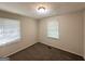 Neutral bedroom with carpet flooring, two windows and freshly painted walls at 250 Glenrose Sw Cir, Atlanta, GA 30354