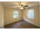 Bright bedroom with neutral paint, modern flooring, ceiling fan and two sunny windows at 250 Glenrose Sw Cir, Atlanta, GA 30354