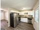 Modern kitchen featuring stainless steel appliances, granite countertops, and bright white cabinets at 250 Glenrose Sw Cir, Atlanta, GA 30354