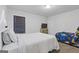 Bright bedroom with white walls and a bed with fun space-themed bedding at 3213 Blackley Old Rd, Douglasville, GA 30135