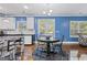Bright dining area with modern lighting, tile backsplash, and a breakfast nook at 3213 Blackley Old Rd, Douglasville, GA 30135