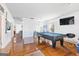 Spacious game room featuring a pool table and hardwood floors at 3213 Blackley Old Rd, Douglasville, GA 30135