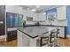 Modern kitchen with white cabinets, granite countertops, and stainless steel appliances at 3213 Blackley Old Rd, Douglasville, GA 30135