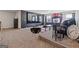 Cozy living room featuring a large screen TV and unique decor at 3213 Blackley Old Rd, Douglasville, GA 30135