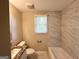Updated bathroom with marble tiles, new toilet, new vanity, and bathtub at 3317 Renault Se Rd, Atlanta, GA 30354