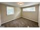 Comfortable bedroom featuring carpeted floors and natural light from two windows at 3317 Renault Se Rd, Atlanta, GA 30354
