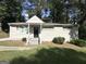 Single-story home with a well-manicured lawn, inviting entrance, and brick exterior at 3317 Renault Se Rd, Atlanta, GA 30354