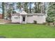 Charming single-story home with a well-manicured lawn and classic brick exterior at 3317 Renault Se Rd, Atlanta, GA 30354