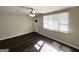 Bright living room featuring hardwood floors, a ceiling fan, and a large window at 3317 Renault Se Rd, Atlanta, GA 30354