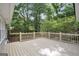 Backyard deck is perfect for entertaining with trees and shrubbery and manicured lawn at 3440 Concord Se Cor, Conyers, GA 30013