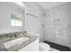 Modern bathroom featuring a vanity, toilet and a shower with beautiful tile work at 3440 Concord Se Cor, Conyers, GA 30013