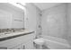 Bright bathroom featuring marble tile, granite vanity, and new fixtures offers a modern and clean aesthetic at 3440 Concord Se Cor, Conyers, GA 30013