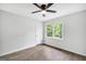 Bedroom features hardwood floors, new fan and light fixture, double pane windows, and freshly painted walls at 3440 Concord Se Cor, Conyers, GA 30013
