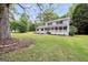 A view of the side of the house showing the large front yard and porch at 3440 Concord Se Cor, Conyers, GA 30013