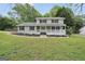 Charming two-story home with a inviting front porch and well-manicured lawn at 3440 Concord Se Cor, Conyers, GA 30013