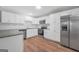 Modern kitchen with stainless steel appliances and white cabinets at 3440 Concord Se Cor, Conyers, GA 30013