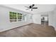 Bright living room with hardwood floors, large windows, and white trim at 3440 Concord Se Cor, Conyers, GA 30013