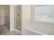 Bright bathroom features a walk-in shower, soaking tub, and natural light at 3634 Cape Ln, Conyers, GA 30013
