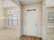 Bright entryway with wainscotting detail, hardwood floors, and access to the dining and living rooms at 3634 Cape Ln, Conyers, GA 30013