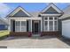 Close up on the front door of a well maintained home with a brick water table at 3634 Cape Ln, Conyers, GA 30013
